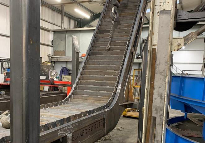 Understanding the Difference Between Tumbleback and Metering Conveyors